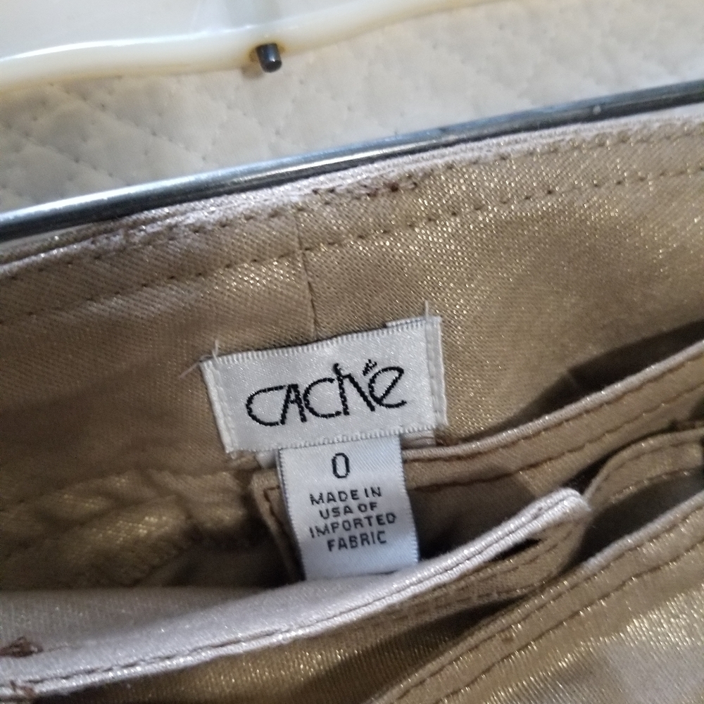 Gold pants / cashe brand. Matching coat sold separ